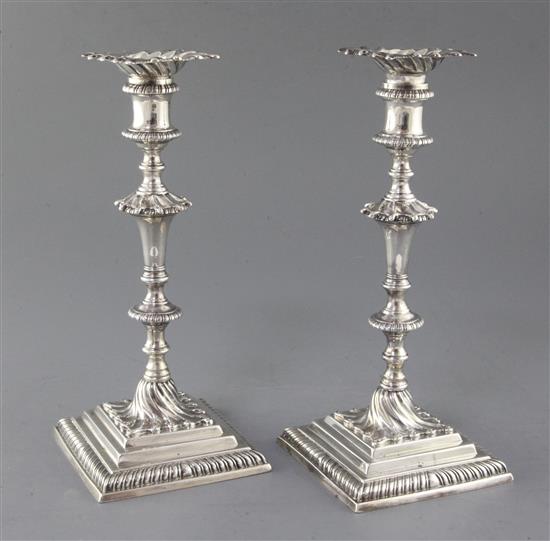 A pair of George III cast silver candlesticks by Ebenezer Coker, 42 oz.